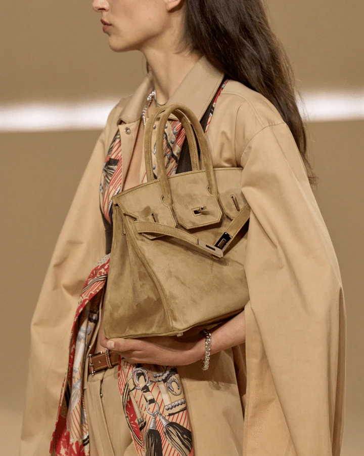 Hermès Spring Summer 2026 collection featuring Birkin bags crafted in soft Doblis calfskin suede in seasonal earth tones.