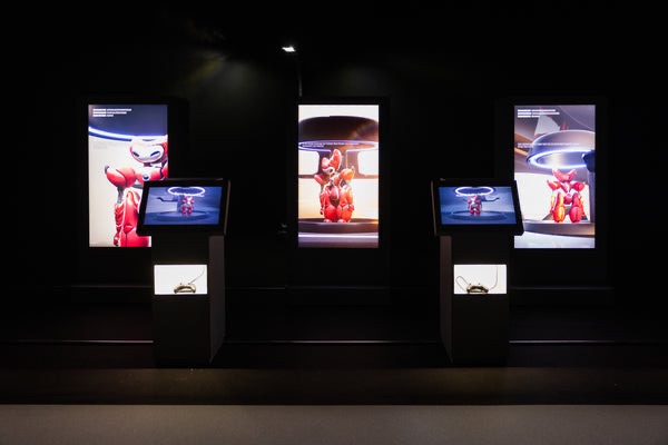 Armoured robot therapist Guanyin set against a cinematic digital landscape of a future smart city in Lawrence Lek’s solo exhibition.